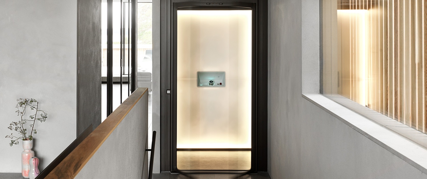 hallway with a glass door leading to a bathroom