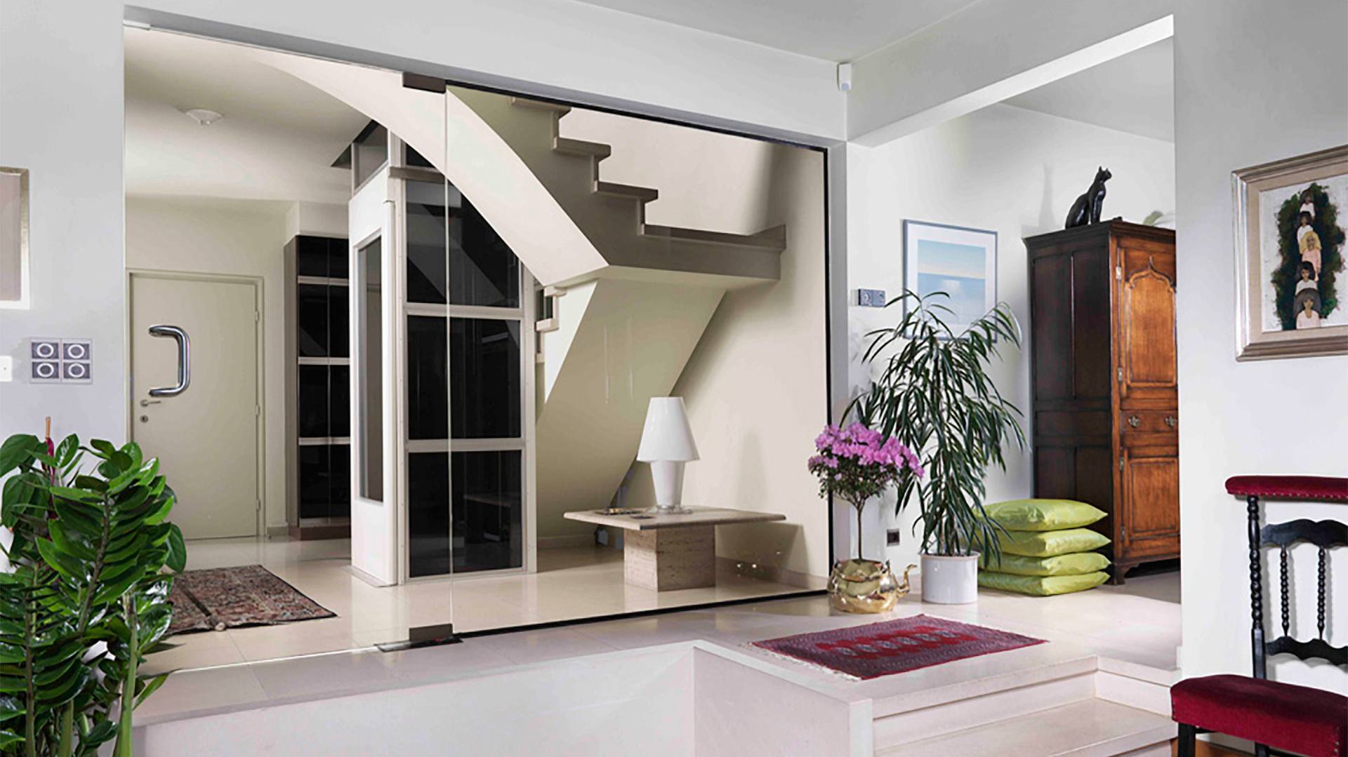 living room with a glass door and stairs