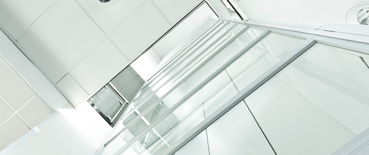 glass stairwell in a modern office building