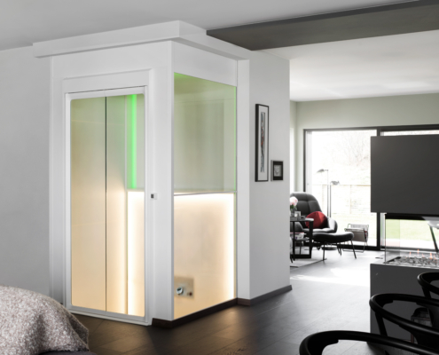 A through-floor lift seamlessly connects different levels, utilizing a lift shaft for smooth vertical transportation.